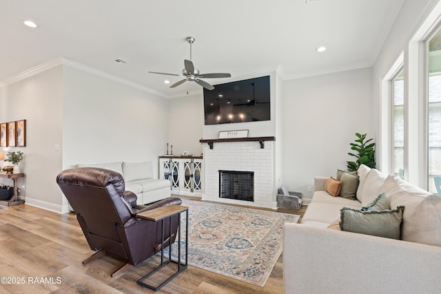 213 Octavia Dr, Scott, LA 70583 - living area featuring recessed lighting, wood finished floors, ceiling fan, ornamental molding, and baseboards
