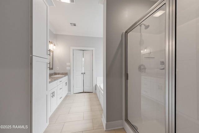 213 Octavia Dr, Scott, LA 70583 - bathroom with ornamental molding, a shower stall, vanity, a garden tub, and tile patterned floors