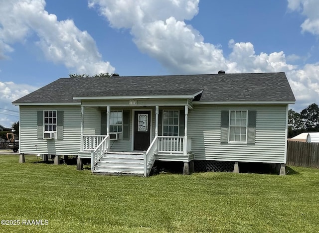 1324 Betty Ln, Abbeville, LA 70510 - manufactured / mobile home with covered porch, roof with shingles, and cooling unit