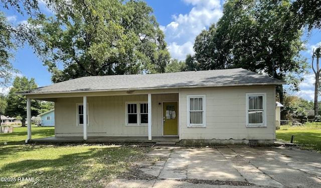 1445 Yukon St, Eunice, LA 70535 - view of front of property featuring a front yard, covered porch, and roof with shingles