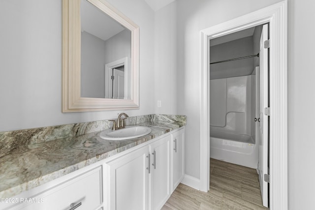 147 Gable Crest Dr, Lafayette, LA 70507 - full bathroom with vanity, shower / tub combination, and wood finished floors