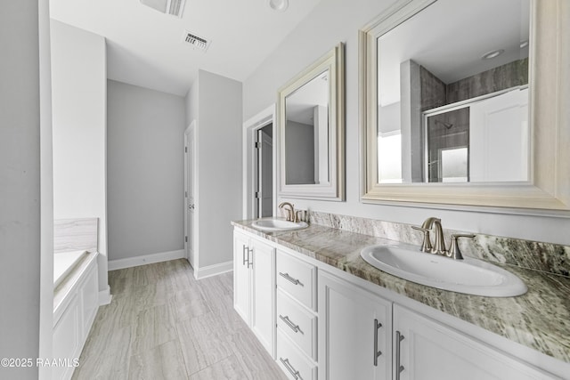 147 Gable Crest Dr, Lafayette, LA 70507 - bathroom featuring double vanity, tiled shower, a bath, and marble finish floors