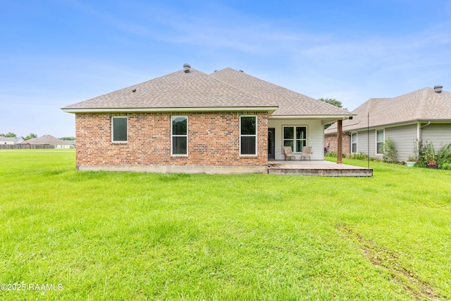147 Gable Crest Dr, Lafayette, LA 70507 - back of property with a patio, roof with shingles, a yard, and brick siding