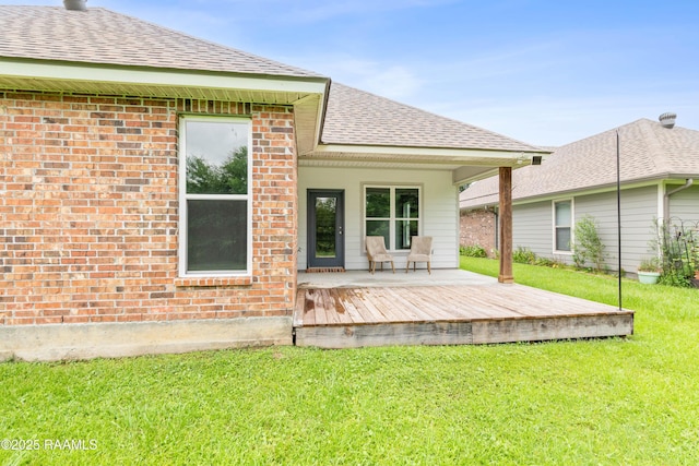 147 Gable Crest Dr, Lafayette, LA 70507 - back of house with a wooden deck, a yard, brick siding, and a shingled roof