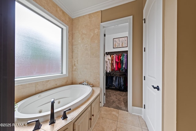 104 Baltimore Ln, Lafayette, LA 70506 - bathroom featuring a whirlpool tub, tile patterned floors, crown molding, and a walk in closet