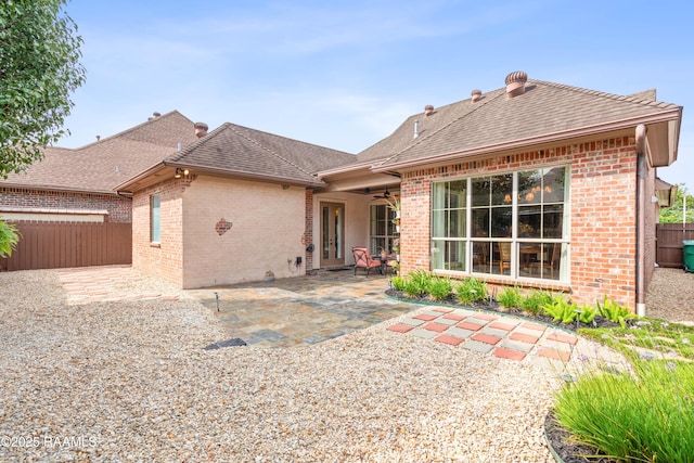 104 Baltimore Ln, Lafayette, LA 70506 - rear view of house with brick siding, a ceiling fan, a patio, and a shingled roof
