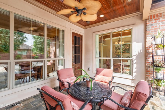 104 Baltimore Ln, Lafayette, LA 70506 - sunroom / solarium with stone tile floors, a ceiling fan, crown molding, and wood ceiling