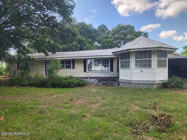 37208 Monceaux Rd, Gueydan, LA 70542 - view of front of property with a front yard and metal roof