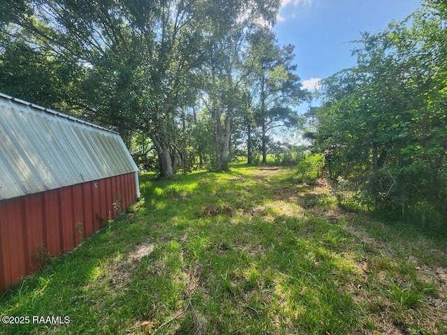 37208 Monceaux Rd, Gueydan, LA 70542 - view of yard featuring an outdoor structure and an outbuilding