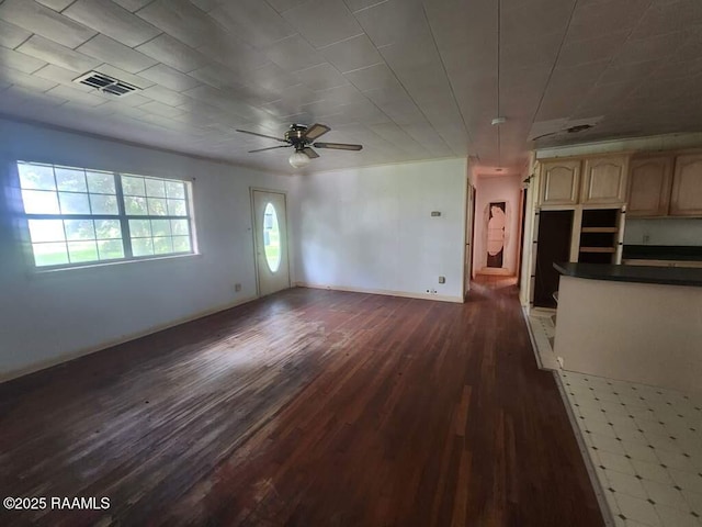 37208 Monceaux Rd, Gueydan, LA 70542 - unfurnished living room featuring dark wood-style flooring, ceiling fan, and baseboards