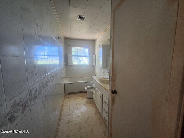 37208 Monceaux Rd, Gueydan, LA 70542 - bathroom with a tub to relax in, vanity, crown molding, and toilet