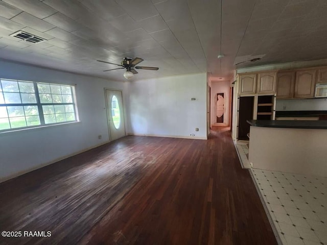37208 Monceaux Rd, Gueydan, LA 70542 - unfurnished living room with dark wood-style floors, ceiling fan, and baseboards