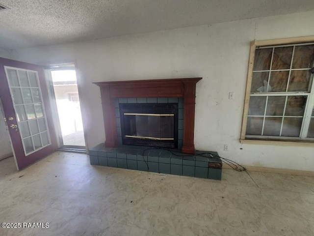 37208 Monceaux Rd, Gueydan, LA 70542 - detailed view of a textured ceiling, a tile fireplace, and tile patterned floors