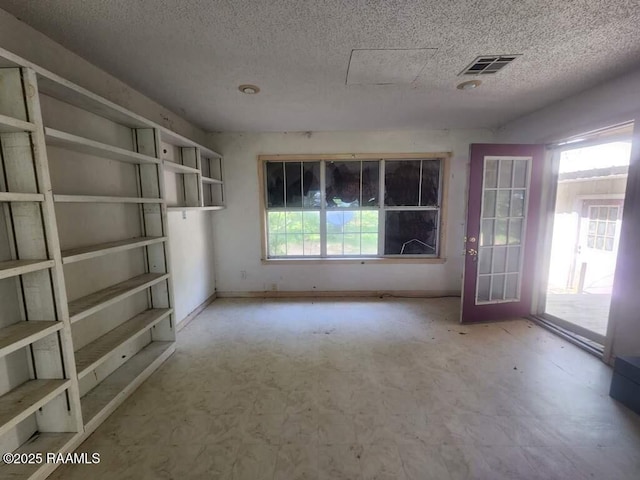 37208 Monceaux Rd, Gueydan, LA 70542 - spare room featuring a textured ceiling