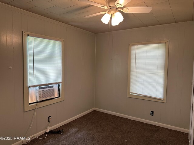 1002 Vidrine St, Opelousas, LA 70570 - spare room with dark carpet, ceiling fan, cooling unit, baseboards, and ornamental molding