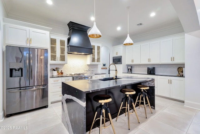 307 Harvest Creek Ln, Lafayette, LA 70508 - kitchen featuring stainless steel appliances, custom range hood, backsplash, light tile patterned floors, and crown molding