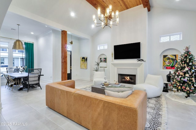 307 Harvest Creek Ln, Lafayette, LA 70508 - living area featuring high vaulted ceiling, light tile patterned floors, a lit fireplace, healthy amount of natural light, and recessed lighting