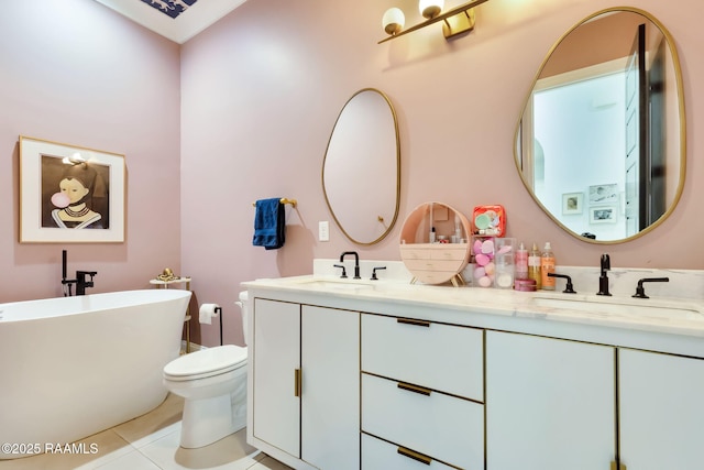 307 Harvest Creek Ln, Lafayette, LA 70508 - bathroom featuring tile patterned flooring, double vanity, and a freestanding tub