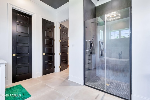 307 Harvest Creek Ln, Lafayette, LA 70508 - full bath featuring a shower stall, a chandelier, and tile patterned flooring