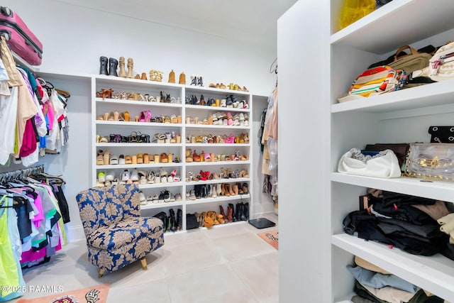 307 Harvest Creek Ln, Lafayette, LA 70508 - walk in closet with tile patterned flooring