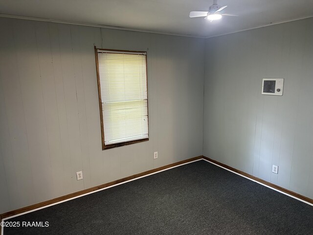 627 S Railroad Ave, Opelousas, LA 70570 - empty room featuring ceiling fan and dark carpet