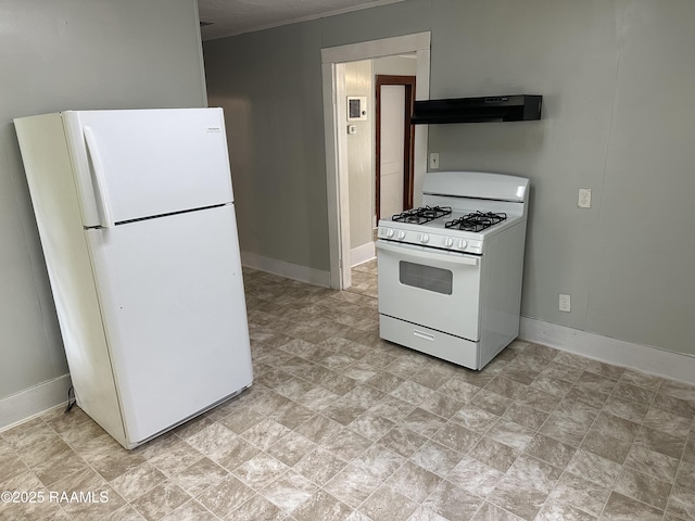 627 S Railroad Ave, Opelousas, LA 70570 - kitchen featuring white appliances, under cabinet range hood, and baseboards