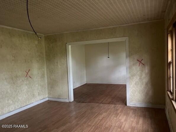 109 Pecan St, Ville Platte, LA 70586 - spare room featuring wood finished floors and baseboards