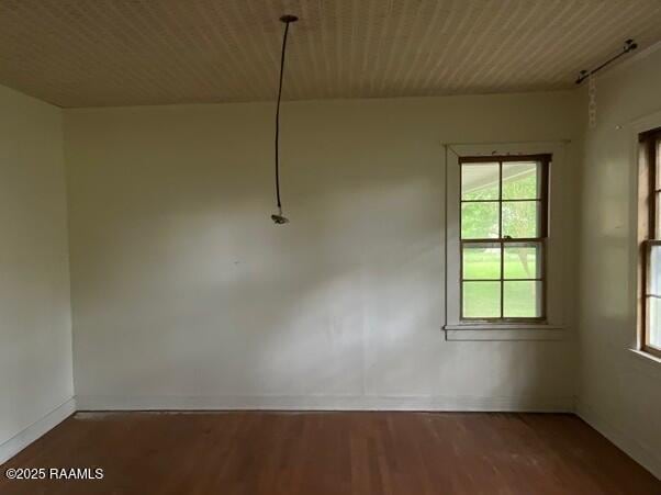109 Pecan St, Ville Platte, LA 70586 - unfurnished dining area featuring healthy amount of natural light, wood finished floors, and baseboards