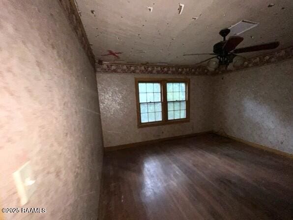 109 Pecan St, Ville Platte, LA 70586 - empty room with wood finished floors, a ceiling fan, and baseboards