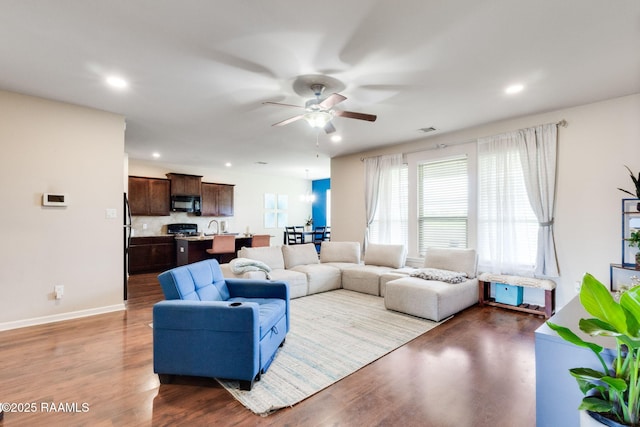 206 Agrarian Ave, Rayne, LA 70578 - living area with ceiling fan, wood finished floors, recessed lighting, and baseboards