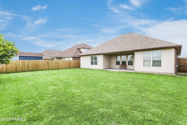 206 Agrarian Ave, Rayne, LA 70578 - back of property featuring a patio area and a shingled roof