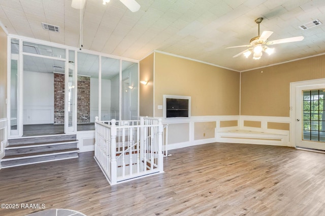 315 Tissington St, Lafayette, LA 70501 - empty room with ceiling fan, wood finished floors, a decorative wall, and crown molding