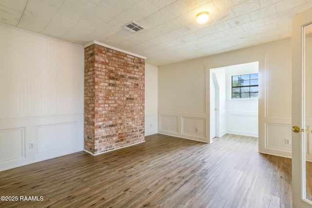 315 Tissington St, Lafayette, LA 70501 - unfurnished room featuring a decorative wall and wood finished floors