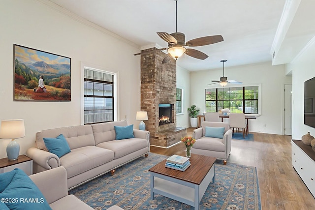 315 Tissington St, Lafayette, LA 70501 - living area featuring a ceiling fan, a brick fireplace, ornamental molding, and wood finished floors