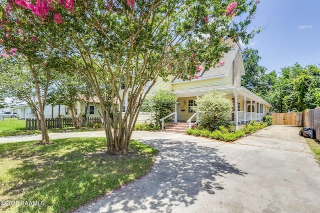 315 Tissington St, Lafayette, LA 70501 - view of property hidden behind natural elements featuring curved driveway and a porch