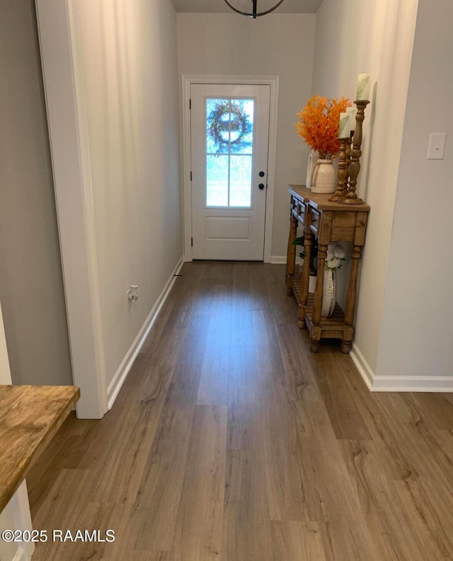 209 Crescent View Ln, Duson, LA 70529 - doorway with wood finished floors and baseboards