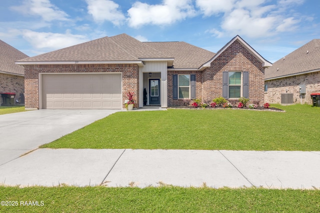 209 Crescent View Ln, Duson, LA 70529 - view of front of home featuring central AC unit, brick siding, concrete driveway, a garage, and a front yard