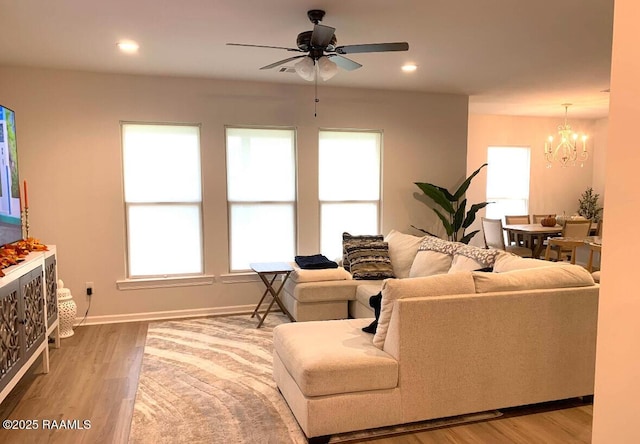 209 Crescent View Ln, Duson, LA 70529 - living room with a ceiling fan, a chandelier, wood finished floors, baseboards, and recessed lighting