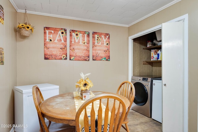 1521 Saint Jude Ave, New Iberia, LA 70560 - dining space with ornamental molding, independent washer and dryer, and light wood-style floors