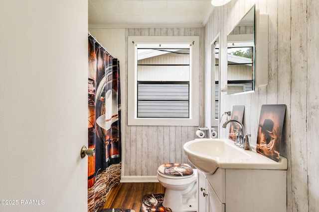 1521 Saint Jude Ave, New Iberia, LA 70560 - full bath with crown molding, vanity, wood finished floors, wooden walls, and curtained shower