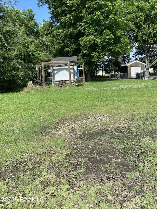 232 Mills St, Scott, LA 70583 - view of yard featuring a storage shed