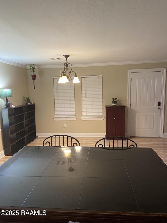 232 Mills St, Scott, LA 70583 - dining area with crown molding and wood finished floors