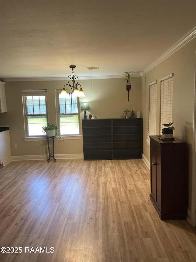 232 Mills St, Scott, LA 70583 - dining room featuring ornamental molding and light wood finished floors