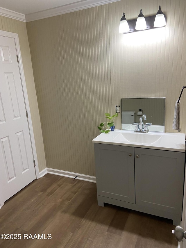 232 Mills St, Scott, LA 70583 - half bath with wood finished floors, vanity, and ornamental molding