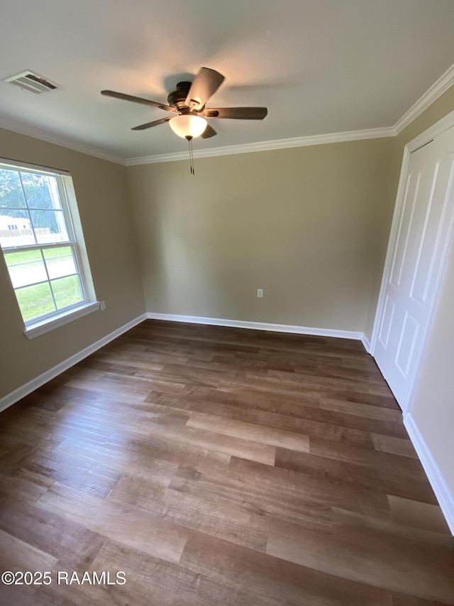 232 Mills St, Scott, LA 70583 - spare room with a ceiling fan, dark wood-style flooring, and crown molding