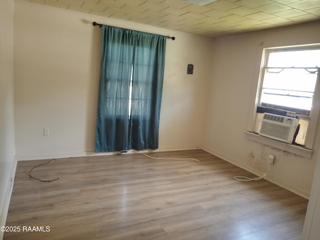 1502 Cherokee St, Abbeville, LA 70510 - unfurnished room with wood finished floors and cooling unit