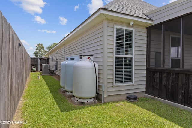 310 Harvest Ln, Abbeville, LA 70510 - exterior view of propane tank and a central air condition unit