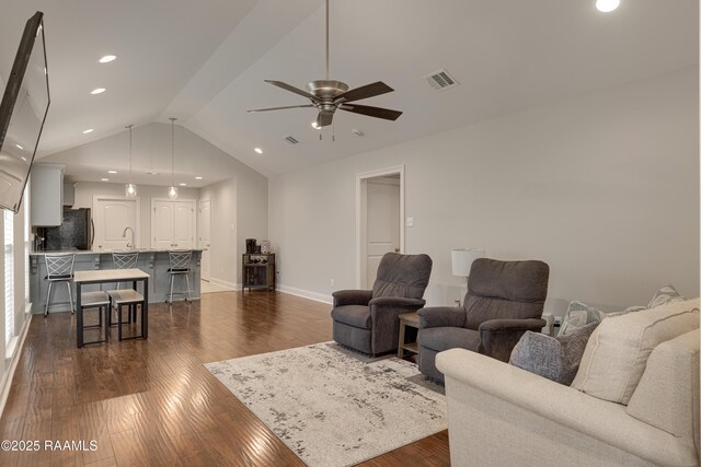 310 Harvest Ln, Abbeville, LA 70510 - living room featuring ceiling fan, dark wood-type flooring, vaulted ceiling, and recessed lighting