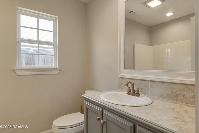 310 Harvest Ln, Abbeville, LA 70510 - bathroom with vanity and decorative backsplash