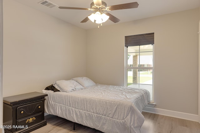 310 Harvest Ln, Abbeville, LA 70510 - bedroom with wood finished floors and ceiling fan